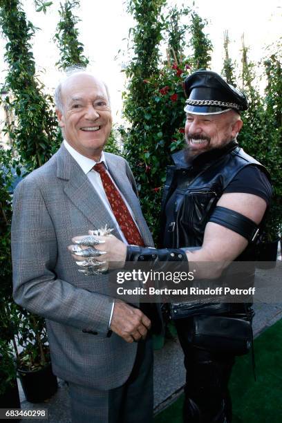 Prince Amyn Aga Khan and Peter Marino attend the "The Garden of Peter Marino" Book Signing at "Moulie Flowers" on May 15, 2017 in Paris, France....