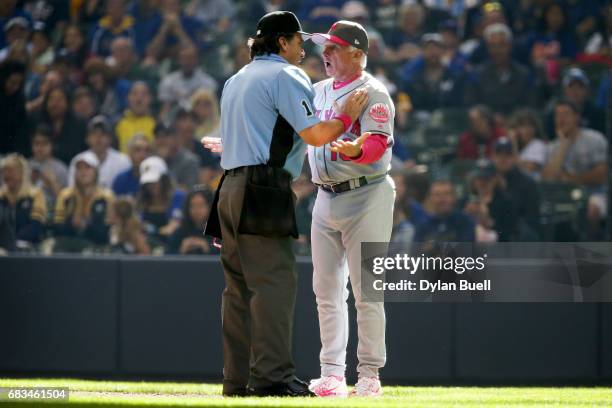 Manager Terry Collins of the New York Mets argues a call with umpire Phil Cuzzi in the eighth inning against the Milwaukee Brewers at Miller Park on...