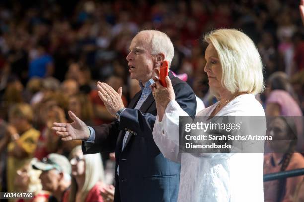 Senator John McCain and wife Cindy attend the MLB game between the Arizona Diamondbacks and the Pittsburgh Pirates at Chase Field on May 14, 2017 in...