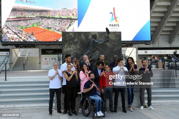 French athletes pose with supporters of the French organising committee, from L to R, Jean-Philippe Gatien, Tony Yoka, Estelle Mossely, Muriel...