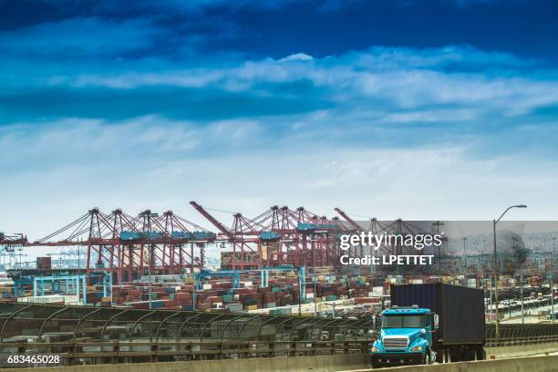 heavy cargo on the road - port of los angeles stock pictures, royalty-free photos & images