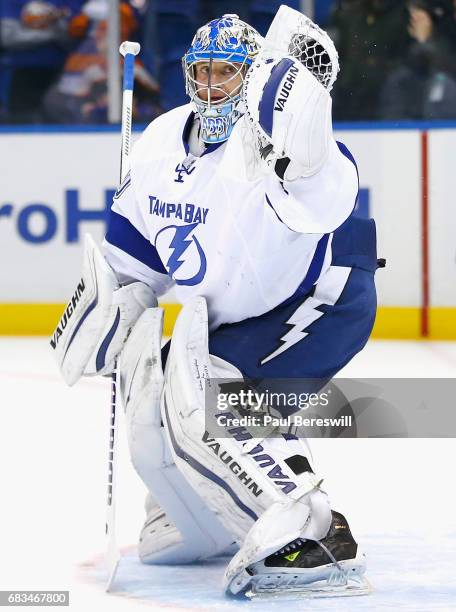 Goaltender Evgeni Nabokov of the Tampa Bay Lightning warms up before the game against the New York Islanders at Nassau Veterans Memorial Coliseum on...