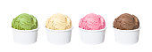 Ice cream scoops in white cups of chocolate, strawberry, vanilla and green tea flavours isolated on white background