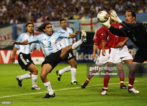 David Seaman of England dives to save from Juan Sorin of Argentina during the Group F match at the World Cup Group Stage played at the Sapporo Dome,...