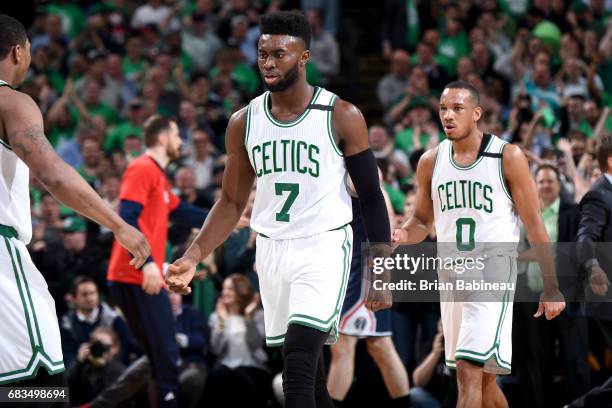 Jaylen Brown of the Boston Celtics high fives his teammates during the game against the Washington Wizards during Game Seven of the Eastern...