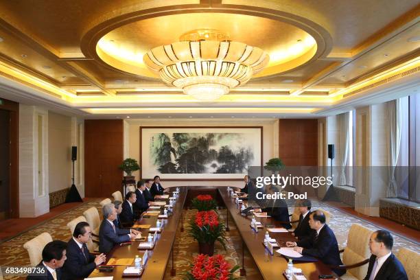 View shows Toshihiro Nikai, Secretary General of the Japanese Liberal Democratic Party and Chinese President Xi Jinping attend a bilateral meeting at...