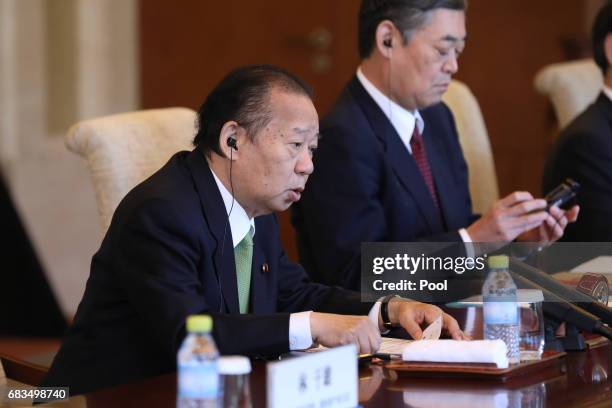 Toshihiro Nikai, Secretary General of the Japanese Liberal Democratic Party, speaks with Chinese President Xi Jinping during a bilateral meeting at...