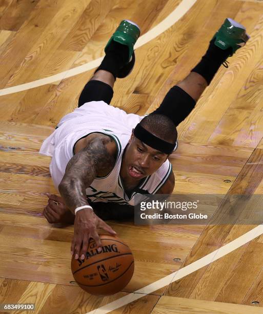 Boston Celtics player Isaiah Thomas looks behind him for the ball after he lost control of the ball as he came up court in the second quarter. He was...