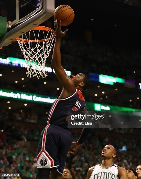 John Wall of the Washington Wizards drives against Avery Bradley of the Boston Celtics during Game Seven of the NBA Eastern Conference Semi-Finals at...