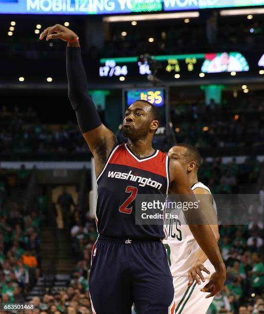 John Wall of the Washington Wizards reacts after his shot against Avery Bradley of the Boston Celtics during Game Seven of the NBA Eastern Conference...