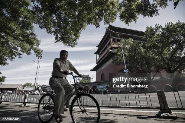 Man rides a bicycle through a traditional hutong neighborhood in Beijing, China, on Sunday, May 14, 2017. Chinas economy is staging a comeback as...