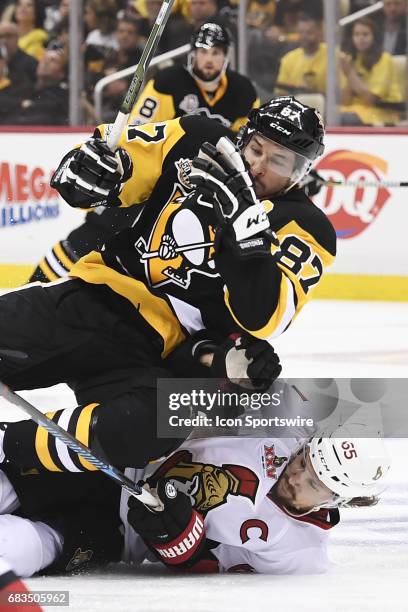 Ottawa Senators defenseman Erik Karlsson takes a tripping penalty on Pittsburgh Penguins Center Sidney Crosby during the second period in Game Two of...