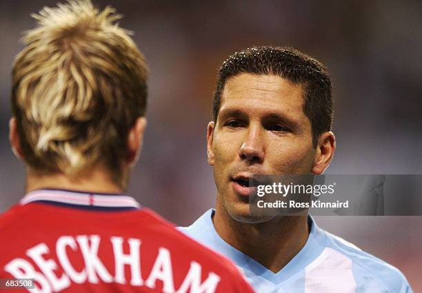 David Beckham of England and Diego Simeone of Argentina before the Group F match of the World Cup Group Stage played at the Sapporo Dome, Sapporo,...