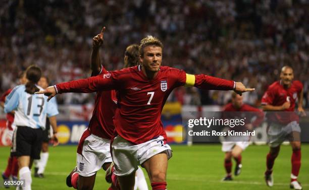 David Beckham Captain of England celebrates scoring during the Group F against Argentina at the World Cup Group Stage played at the Sapporo Dome,...