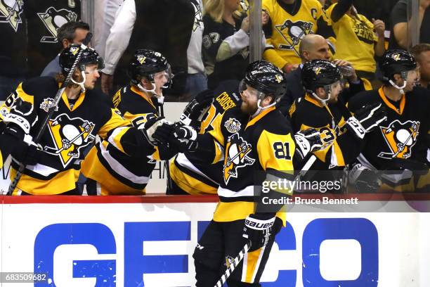 Phil Kessel of the Pittsburgh Penguins celebrates with his teammates after scoring a goal against Craig Anderson of the Ottawa Senators during the...