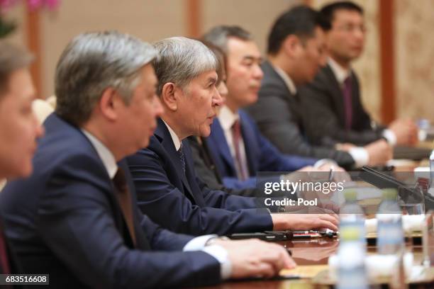 Kyrgyzstan President Almazbek Sharshenovich Atambayev speaks with Chinese President Xi Jinping during a bilateral meeting at Diaoyutai State...