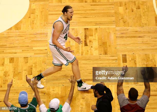 Kelly Olynyk of the Boston Celtics reacts against the Washington Wizards during Game Seven of the NBA Eastern Conference Semi-Finals at TD Garden on...