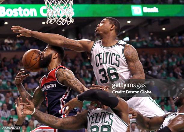 Boston Celtics guard Marcus Smart and the Celtics defense put the clamps on Washington Wizards forward Markieff Morris on this play during the third...