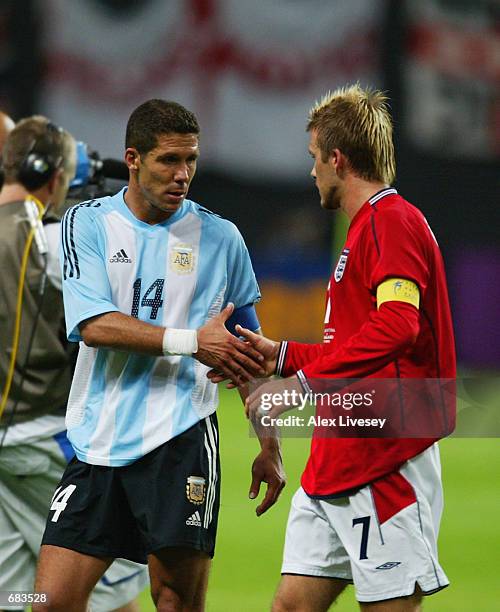 David Beckham of England shakes hands with Diego Simeone of Argentina after the England v Argentina, Group F, World Cup Group Stage match played at...