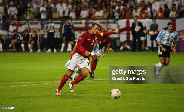 David Beckham of England takes the winning penalty after Michael Owen was brought down during the England v Argentina, Group F, World Cup Group Stage...