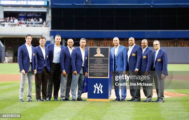 Derek Jeter poses with his Monument Park plaque with former teammates Paul O'Neill, Tino Martinez, Andy Pettitte, Mariano Rivera, Jorge Posada,...