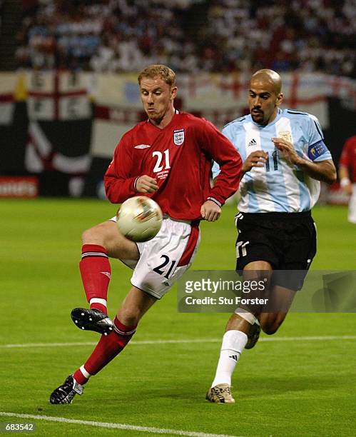 Nicky Butt of England takes on Juan Veron of Argentina during the England v Argentina, Group F, World Cup Group Stage match played at the Sapporo...