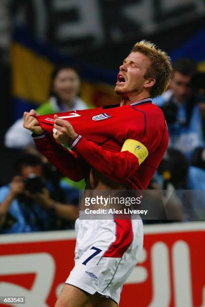David Beckham of England celebrates after scoring the opening goal during the England v Argentina, Group F, World Cup Group Stage match played at the...