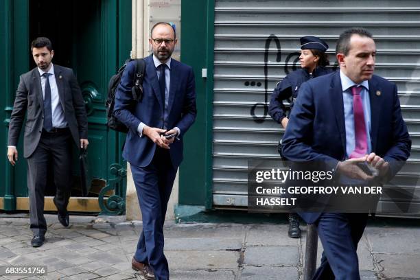 France's newly appointed Prime Minister Edouard Philippe walks out his home in Paris on May 16, 2017 before going to the Hotel Matignon. New French...