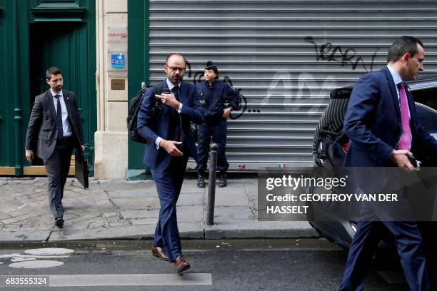 France's newly appointed Prime Minister Edouard Philippe walks out his home in Paris on May 16, 2017 before going to the Hotel Matignon. New French...