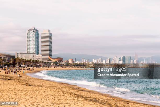 barceloneta beach and barcelona city skyline, barcelona, catalonia, spain - barceloneta fotografías e imágenes de stock