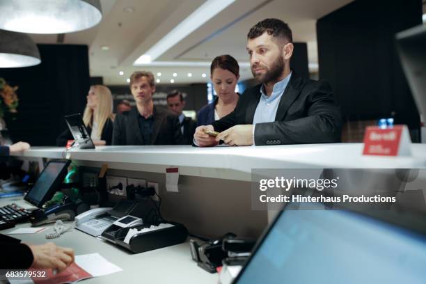 businessman waiting to check into a hotel - reception 2017 ストックフォトと画像