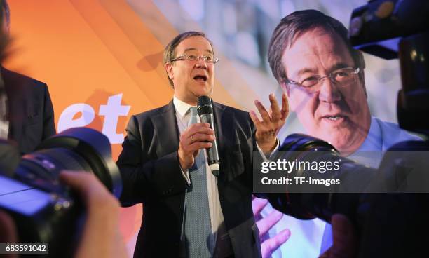 Armin Laschet, lead candidate of the German Christian Democrats , speaks to supporters after initial results in state elections in North...