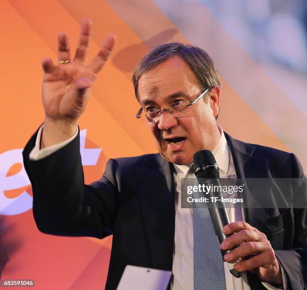 Armin Laschet, lead candidate of the German Christian Democrats , speaks to supporters after initial results in state elections in North...