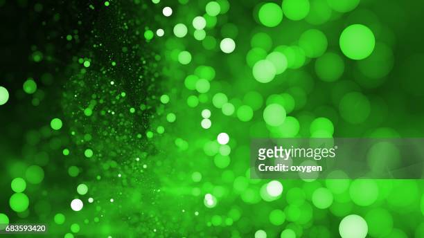 abstract green bokeh sparkling spray circle - focus on background stock pictures, royalty-free photos & images