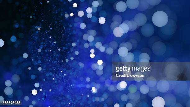 abstract blue bokeh sparkling spray circle - christmas bokeh ストックフォトと画像