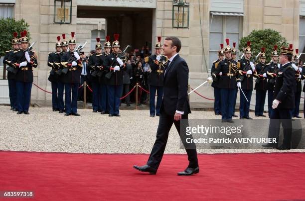 French newly elected President Emmanuel Macron poses at the Elysée presidential Palace during the handover ceremony with his predecessor François...