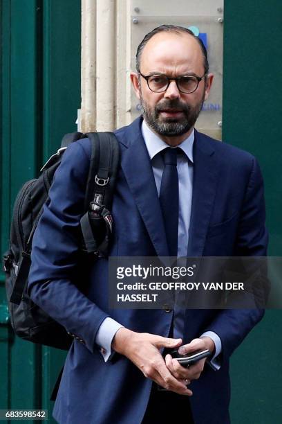 France's newly appointed Prime Minister Edouard Philippe walks out his home in Paris on May 16, 2017 before going to the Hotel Matignon. - New French...