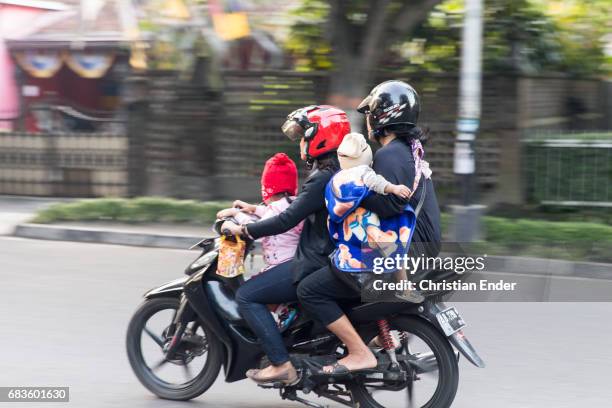 traffic scene in yogyakarta city, java, idonesia - left hand drive car stock pictures, royalty-free photos & images