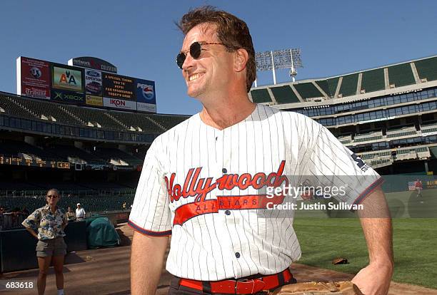 Actor John Callahan walks to the dugout during a softball game between the Hollywood All-Stars and the San Francisco Forty Niners Alumni June 8, 2002...
