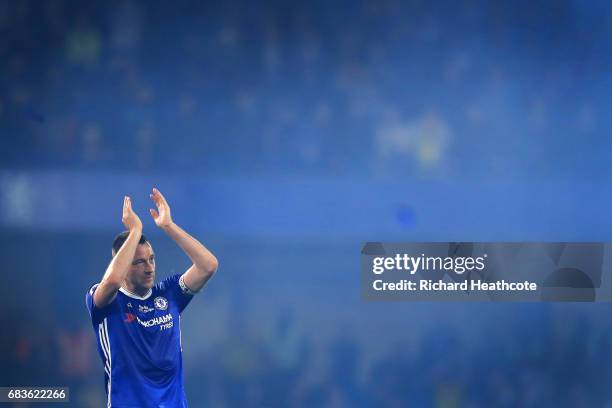 Chelsea captain John Terry applaudes the fans at the end of the Premier League match between Chelsea and Watford at Stamford Bridge on May 15, 2017...
