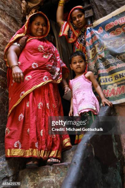 Dehli, India Mother with her two daughters in a slum of the city district Seemapuri, where the Caritas and the NGO Chentanalaya support urban...