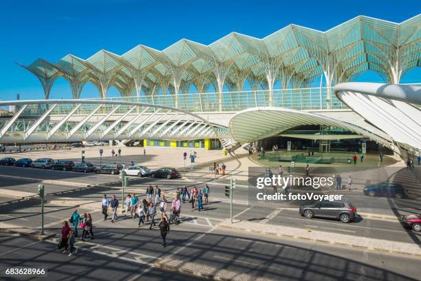 lisbon people crossing outside gare do oriente train station porugal - oriente station stock pictures, royalty-free photos & images