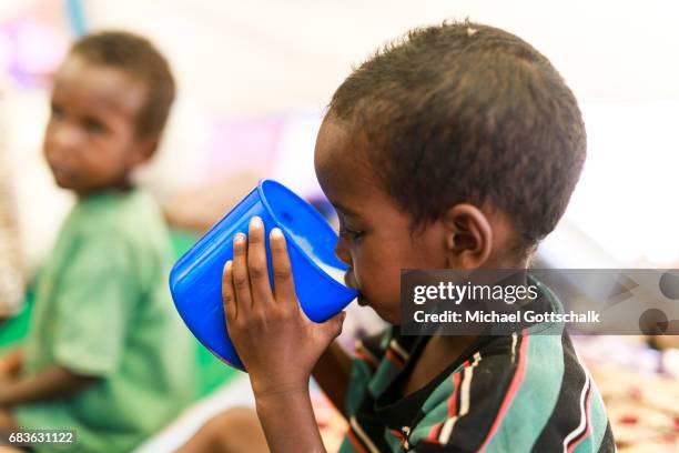 Waaf Dhuung, Ethiopia A child is drinking milk made of milk powder at the Unicef feeding in a village in the Somali region of Ethiopia, where...