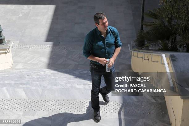 S security director Anthony Agostini walks in the Bastia's court house on May 16, 2017 during the second day of the trial of Bastia's supporters for...