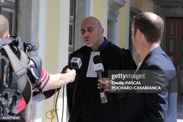 S security director Anthony Agostini's lawyer Jean-Michel Albertini answers journalists in the Bastia's court house on May 16, 2017 during the second...