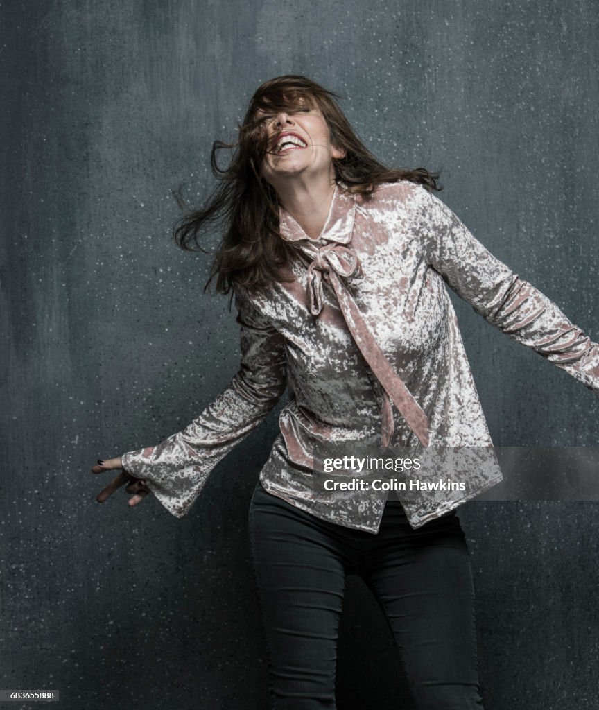 Woman dancing with hair falling over face