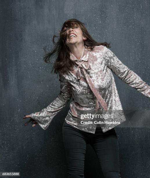 woman dancing with hair falling over face - silver blouse stock pictures, royalty-free photos & images