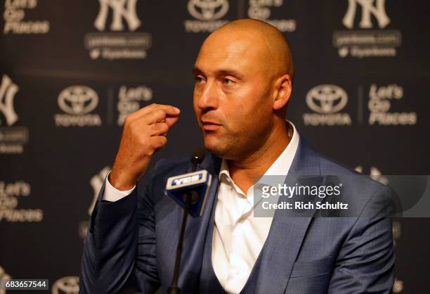 Former New York Yankees great, Derek Jeter address the media after a pregame ceremony honoring him and retiring his number 2 at Yankee Stadium on May...