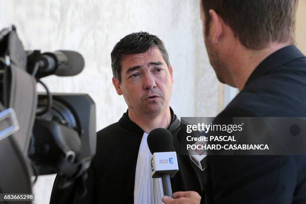 Supporters's lawyer Marc Antoine Luca answers journalists at Bastia's court house on May 16, 2017 during the second day of the trail of Bastia's...