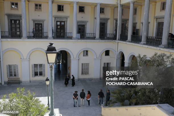 Bastia's supporters wait in the courtyard of Bastia's court house on May 16, 2017 during the second day of the trial of Bastia's supporters for the...